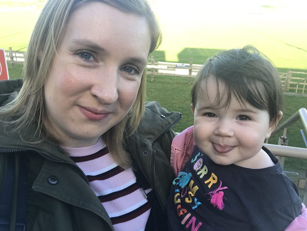 Lottie and Mummy stood with the background of the Lincolnshire Showground fields