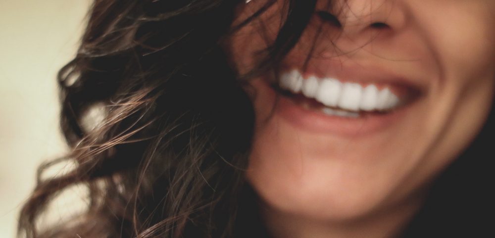 Brunette Lady With Large Toothy Smile