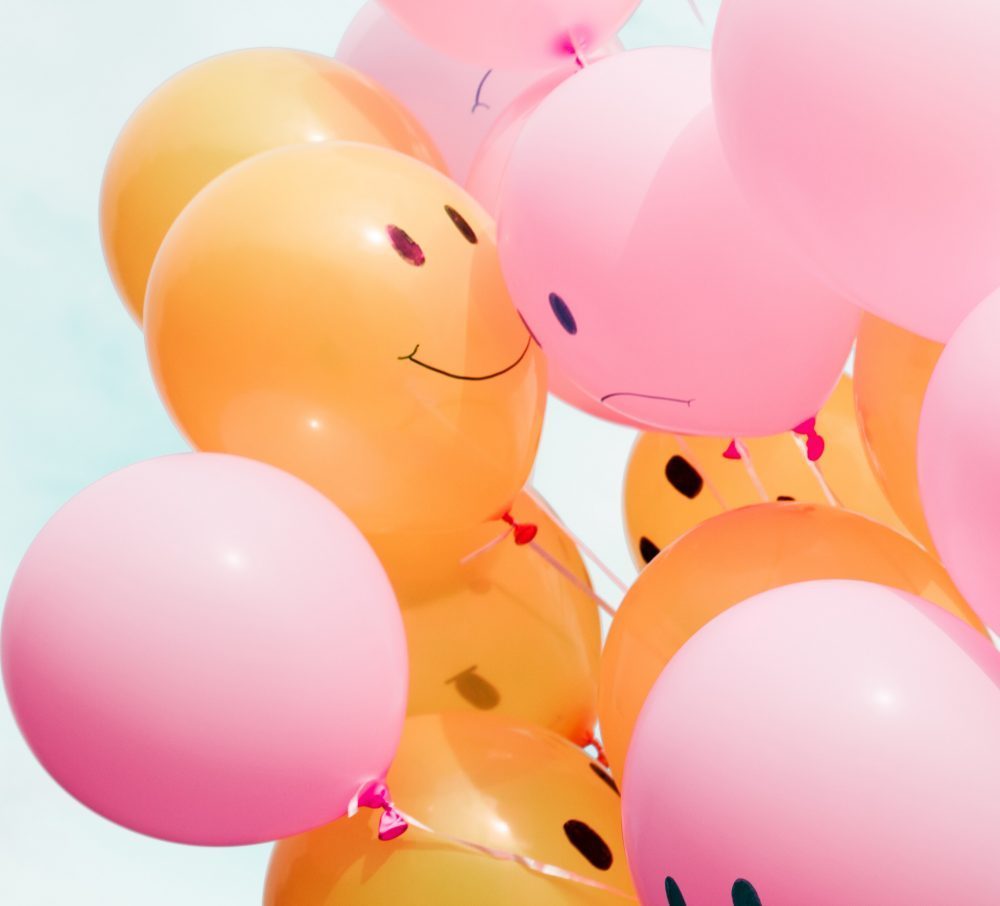 Pink and Orange Balloons with Smiley and Sad Faces