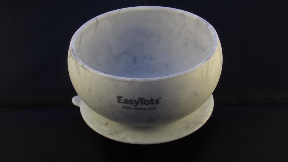 Marble effect suction bowl against black background