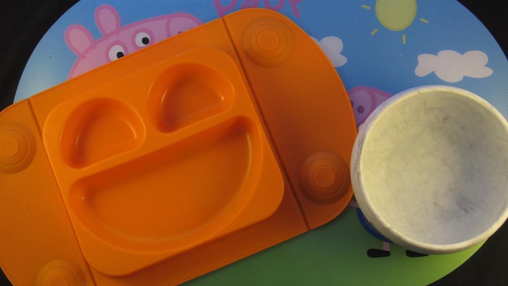 Orange mat and grey bowl on top of peppa pig mat. Top Baby Product - EasyTots