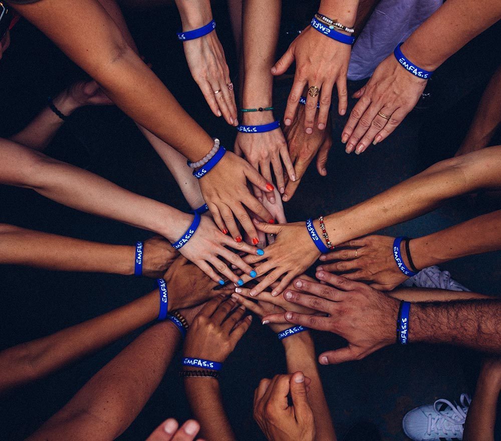 lots of hands all together in the middle. Support Group positives