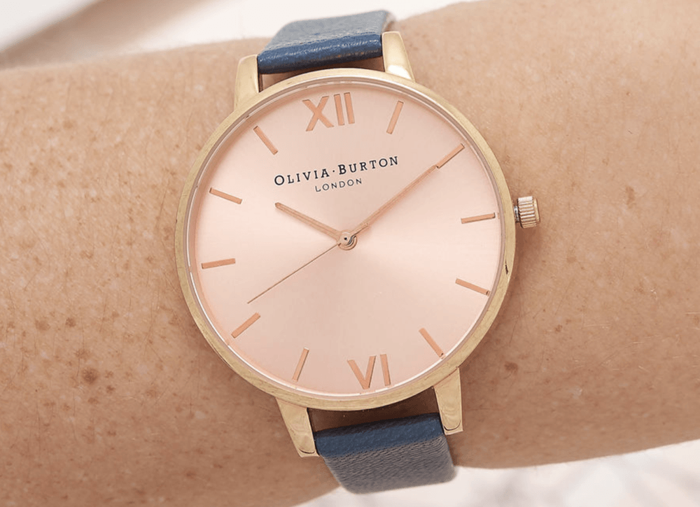 Rose gold olivia burton watch with navy blue stap