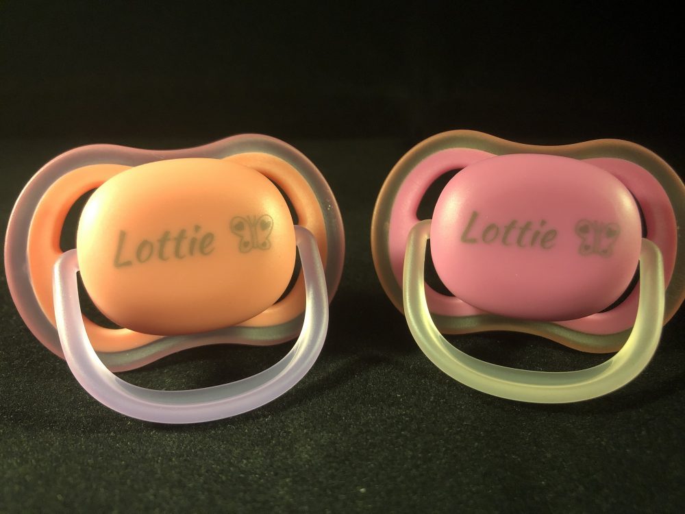 Personalised orange and pink dummies